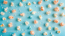 Colorful Popcorn on Light Blue Background