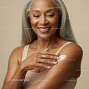 Elegant Senior Woman Applying Lotion for Glowing Skin