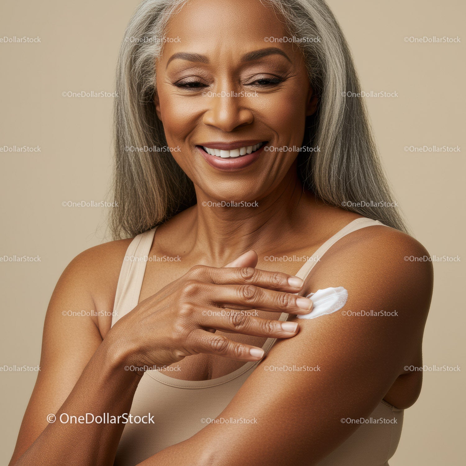 Elegant Senior Woman Applying Lotion for Glowing Skin