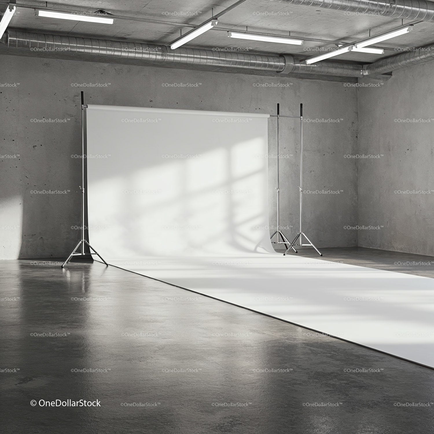 Empty photo studio with white backdrop and industrial interior