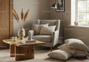 Cozy reading nook with armchair and wooden coffee table