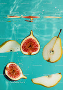 Fresh fig and pear slices submerged in clear water