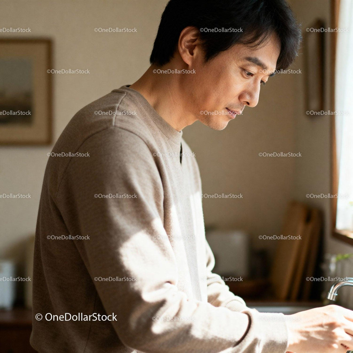Thoughtful man washing hands by kitchen window