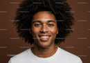 Portrait of a Smiling Young Man with Curly Hair and Freckles