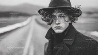 Moody Black and White Portrait of a Young Man with Windblown Hair
