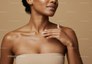 Elegant Woman Applying Moisturizer with Smooth Skin and Confident Expression