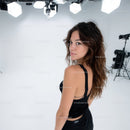 Stylish Woman with Wavy Hair in Studio Portrait
