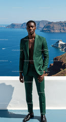 Stylish man in green suit overlooking coastal cliffs