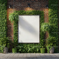 Blank white billboard framed by lush green plants outdoors