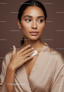 Elegant Woman Applying Skincare Lotion for Flawless Skin