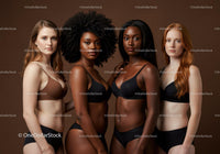 Diverse Women Posing Confidently in Lingerie Against Brown
