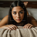 Close-Up of Beautiful Woman with Brown Eyes Lying on Cozy Blanket