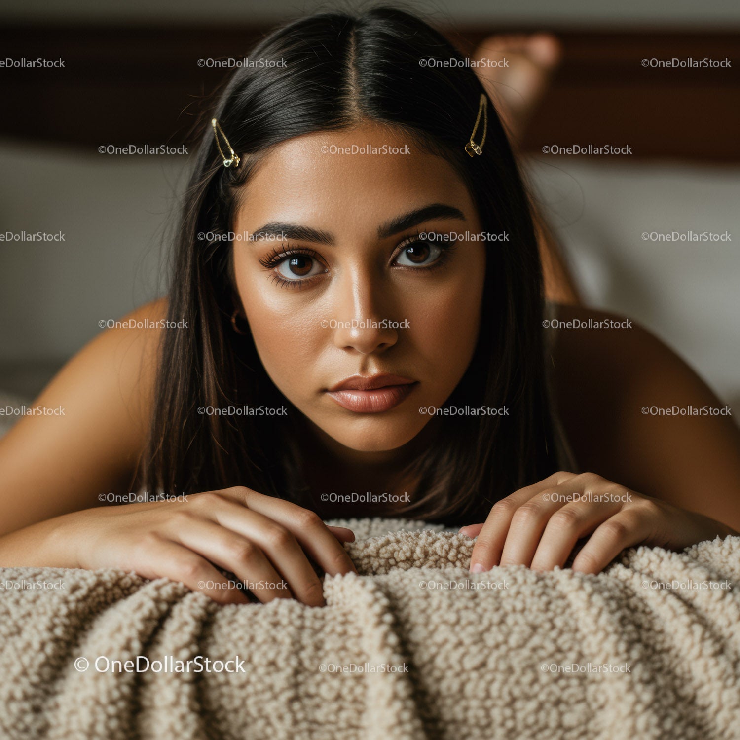 Close-Up of Beautiful Woman with Brown Eyes Lying on Cozy Blanket