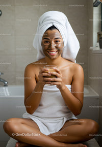 Smiling Woman Applying Facial Mask in Bathroom for Skincare Relaxation
