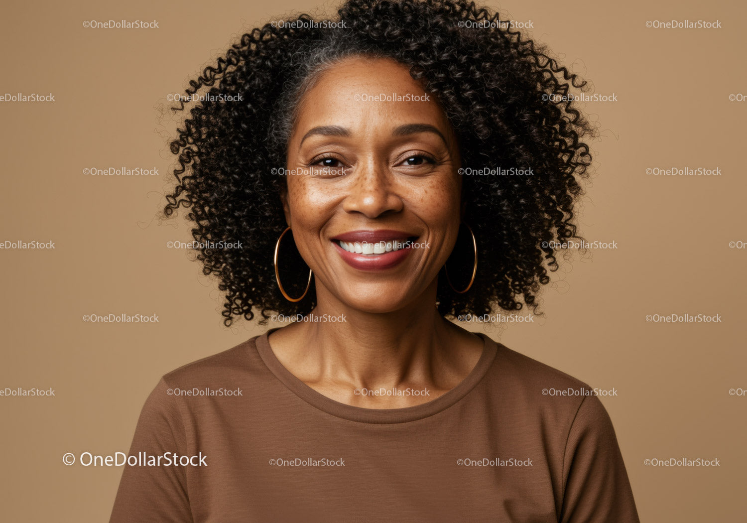 Portrait of a Smiling Afro-Haired Woman with Earrings in Neutral Background
