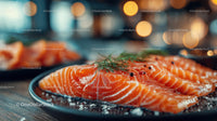Fresh Sliced Smoked Salmon with Herbs and Sea Salt on Black Plate