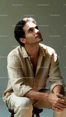 Thoughtful man looking up in soft natural light