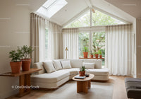 Bright modern living room with neutral tones and plants