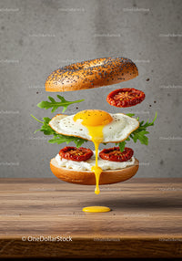 Flying bagel sandwich with egg and sun-dried tomatoes