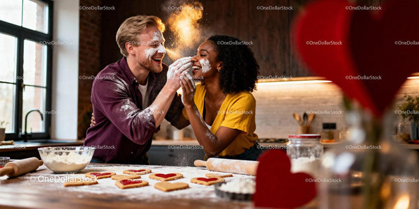 Couple Playfully Baking Heart-Shaped Cookies Together