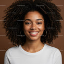 Portrait of a Smiling Young Woman with Curly Hair Against Brown Background