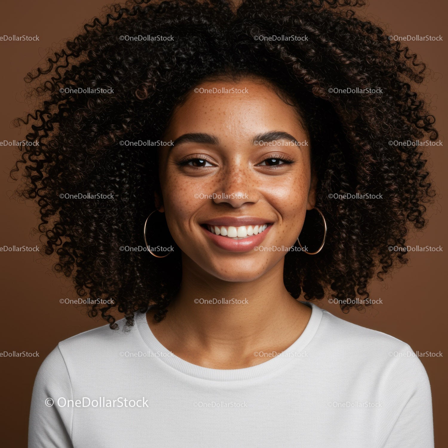 Portrait of a Smiling Young Woman with Curly Hair Against Brown Background
