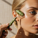 Woman Using Jade Roller for Facial Skincare Treatment