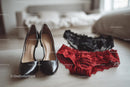 Chic Black Heels and a Red Lace Dress in a Cozy Bedroom Setting