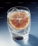 Sparkling Water with Grapefruit Slice and Ice Cube on Dark Background