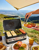 Grilling fresh asparagus and cheese with ripe tomatoes outdoors