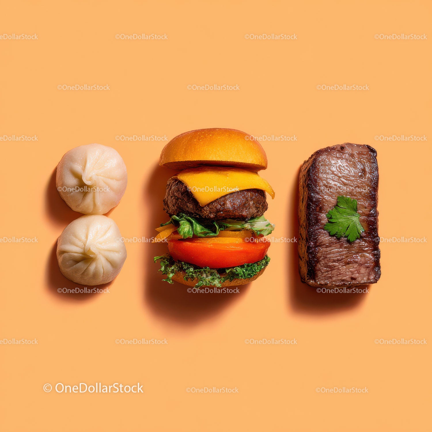 Gourmet Burger with Lettuce and Tomato Next to Grilled Steak and Dumpling