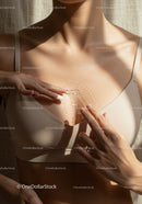 Close-Up of Woman Moisturizing Skin with Lotion in Soft Natural Light