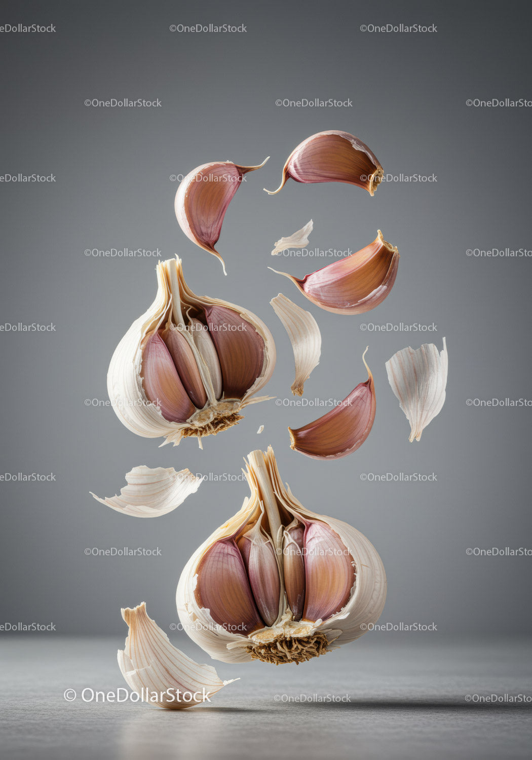 Floating garlic cloves with delicate papery skins