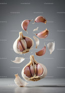 Floating garlic cloves with delicate papery skins