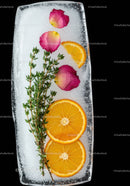 Frozen orange slices with thyme and rose petals block