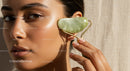 Close Up of a Woman Using Jade Roller for Skin Rejuvenation