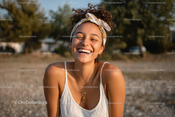 Joyful Woman Smiling Outdoors on Sunny Summer Day
