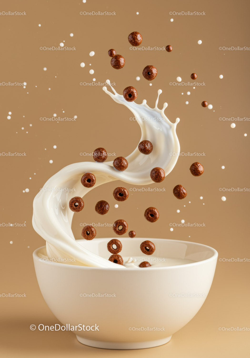 Cocoa cereal rings splashing into milk bowl