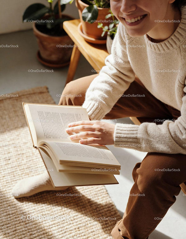 Smiling person reading book in cozy natural light