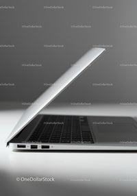 Minimalist Silver Laptop with Keyboard on White Surface