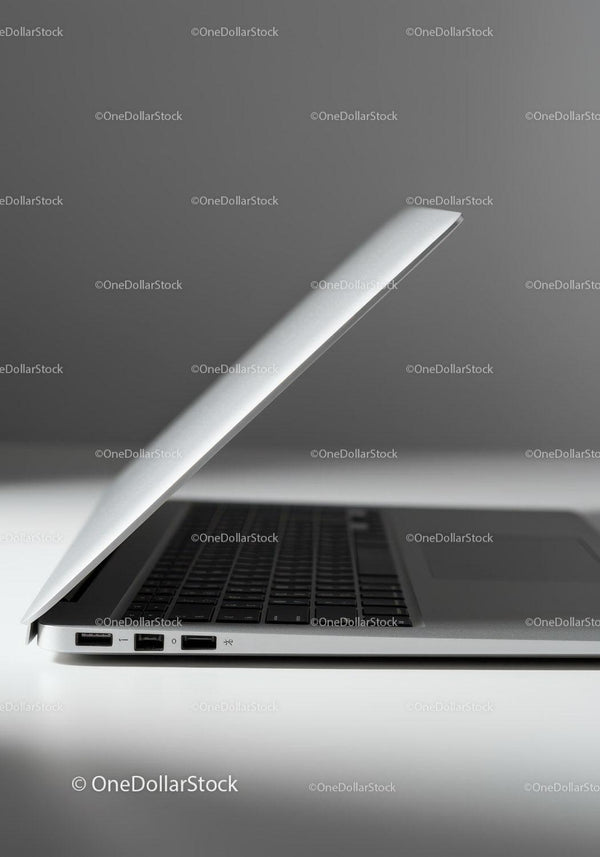 Minimalist Silver Laptop with Keyboard on White Surface