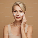 Elegant Woman Applying Face Cream for Flawless Skin