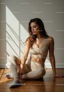 Young woman relaxing after workout in soft natural light