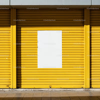 Bright yellow storefront with blank white poster