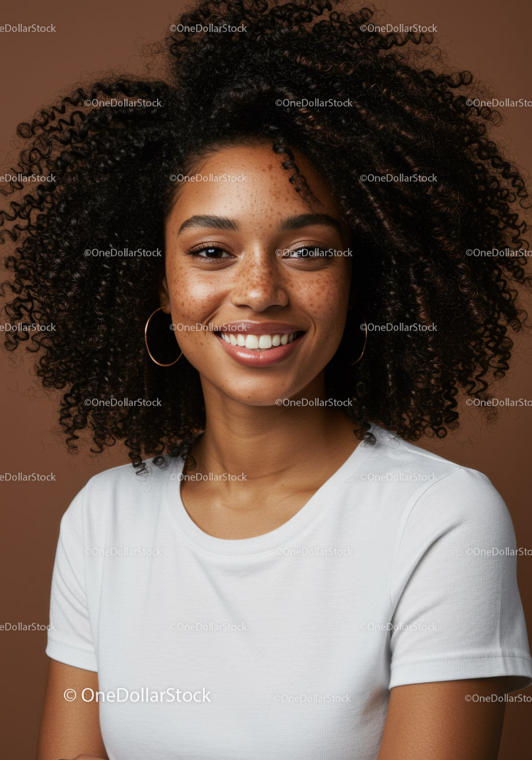 Confident Ethnic Woman with Curly Hair and Bright Smile in Studio