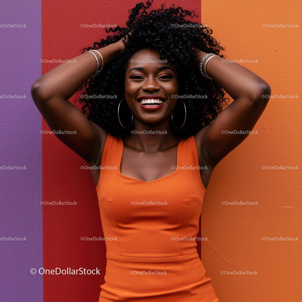 Vibrant and Happy African American Woman in Orange Dress Against Colorful Wall