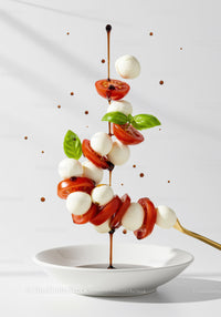Fresh Caprese Salad Ingredients Floating Over Bowl