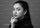 Elegant Black and White Portrait of a Confident Woman with Hoop Earrings