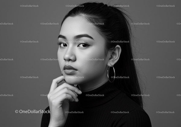 Elegant Black and White Portrait of a Confident Woman with Hoop Earrings