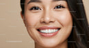 Close up of smiling young woman with clear skin